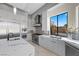 Modern kitchen with stainless steel appliances and marble countertops at 9780 Solar Ave, Las Vegas, NV 89149