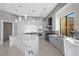 Modern kitchen with large island and marble countertop at 9780 Solar Ave, Las Vegas, NV 89149