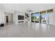 Bright living room with marble fireplace and large windows at 9780 Solar Ave, Las Vegas, NV 89149