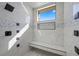 Large walk-in shower with multiple shower heads and built-in seating at 9780 Solar Ave, Las Vegas, NV 89149