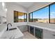 Wet bar with marble countertop and wine coolers at 9780 Solar Ave, Las Vegas, NV 89149