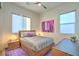 Charming bedroom with wood bed frame and purple rug at , Las Vegas, NV 89138