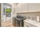 Modern laundry room with washer, dryer, storage, and a sink at , Las Vegas, NV 89138