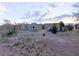 Large, unlandscaped lot with a view of the home's back elevation at 1032 Morning Sun Way, Las Vegas, NV 89110