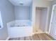 Bathroom with a luxurious jetted tub and a separate shower at 1032 Morning Sun Way, Las Vegas, NV 89110