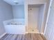 Bathroom with a luxurious jetted tub and a separate shower at 1032 Morning Sun Way, Las Vegas, NV 89110