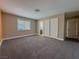 Main bedroom with carpet, en-suite bathroom, and ample closet space at 1032 Morning Sun Way, Las Vegas, NV 89110