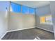 Well-lit bedroom with grey carpet and large windows at 1032 Morning Sun Way, Las Vegas, NV 89110