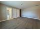 Bedroom with gray carpet and access to a hallway at 1032 Morning Sun Way, Las Vegas, NV 89110