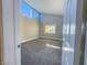 Spacious bedroom with neutral walls and carpet, plus multiple windows at 1032 Morning Sun Way, Las Vegas, NV 89110