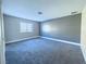 Spacious bedroom with gray walls and carpet at 1032 Morning Sun Way, Las Vegas, NV 89110