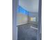 Bright bedroom featuring grey carpeting and multiple windows at 1032 Morning Sun Way, Las Vegas, NV 89110