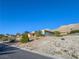 Single-story home with mountain views, situated on a rocky lot at 1032 Morning Sun Way, Las Vegas, NV 89110