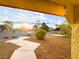 Landscaped yard with walkway and sunset view at 1032 Morning Sun Way, Las Vegas, NV 89110
