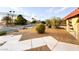 Landscaped yard with walkway leading to house at 1032 Morning Sun Way, Las Vegas, NV 89110