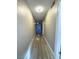 Long hallway with light wood laminate flooring at 1032 Morning Sun Way, Las Vegas, NV 89110