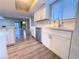 Modern kitchen with white cabinets, quartz counters and island at 1032 Morning Sun Way, Las Vegas, NV 89110
