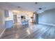 Modern kitchen with island, stainless steel appliances, and light grey vinyl flooring at 1032 Morning Sun Way, Las Vegas, NV 89110