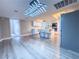 Modern kitchen with island, stainless steel appliances, and light grey vinyl flooring at 1032 Morning Sun Way, Las Vegas, NV 89110