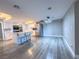 Modern kitchen with island, stainless steel appliances, and light grey vinyl flooring at 1032 Morning Sun Way, Las Vegas, NV 89110