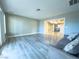 Living room with hardwood floors and views to other rooms at 1032 Morning Sun Way, Las Vegas, NV 89110