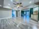 Living room with hardwood floors, a ceiling fan, and built-in bar at 1032 Morning Sun Way, Las Vegas, NV 89110