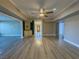 Spacious living room featuring hardwood floors and built-in cabinetry at 1032 Morning Sun Way, Las Vegas, NV 89110