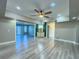 Bright living room with hardwood floors and access to other rooms at 1032 Morning Sun Way, Las Vegas, NV 89110