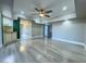 Spacious living room featuring hardwood floors and a ceiling fan at 1032 Morning Sun Way, Las Vegas, NV 89110