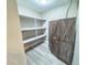 Spacious pantry with ample shelving and rustic wooden cabinet at 1032 Morning Sun Way, Las Vegas, NV 89110