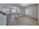 Bright and airy living room with wood-look tile floors at 10598 Aphrodite St, Las Vegas, NV 89183