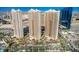 Aerial view of three luxury high-rise residential buildings at 135 E Harmon Ave # 2302, Las Vegas, NV 89109