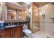 Bathroom with walk-in shower and dark wood vanity at 135 E Harmon Ave # 2302, Las Vegas, NV 89109