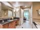 Elegant bathroom with a soaking tub, separate shower, and modern vanity at 135 E Harmon Ave # 2302, Las Vegas, NV 89109