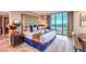 King-size bed, city view, and sitting area with a desk at 135 E Harmon Ave # 2302, Las Vegas, NV 89109