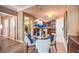 Bright dining area with a glass table and chairs, near the kitchen and bathroom at 135 E Harmon Ave # 2302, Las Vegas, NV 89109