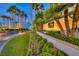 Luxury building entrance with landscaping and signage at 135 E Harmon Ave # 2302, Las Vegas, NV 89109
