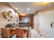 Eat-in kitchen with breakfast bar and dark wood cabinets at 135 E Harmon Ave # 2302, Las Vegas, NV 89109