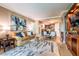 Elegant living room with hardwood floors, stylish furniture and city views at 135 E Harmon Ave # 2302, Las Vegas, NV 89109