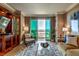 Living room boasts large windows, comfortable seating, and stunning city views at 135 E Harmon Ave # 2302, Las Vegas, NV 89109