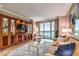 Bright living room featuring a large window, comfy seating, and city views at 135 E Harmon Ave # 2302, Las Vegas, NV 89109