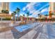Relaxing pool and spa area with lounge chairs and palm trees at 135 E Harmon Ave # 2302, Las Vegas, NV 89109