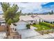 This aerial view shows a single-story home with a well-manicured lawn and a two-car garage at 1905 Rose Coral Ave, Las Vegas, NV 89106