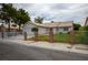 Cozy home featuring a manicured lawn and decorative brick pillar gated entrance at 1905 Rose Coral Ave, Las Vegas, NV 89106