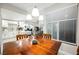 Bright dining area with wood table and chairs, adjacent to kitchen at 2050 W Warm Springs Rd # 811, Henderson, NV 89014