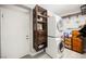 Laundry room with stackable washer and dryer, shelving at 2050 W Warm Springs Rd # 811, Henderson, NV 89014