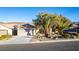 Single-story home with landscaped yard and a two-car garage at 2248 Shadow Canyon Dr, Henderson, NV 89044