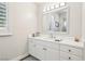 Bright bathroom with white vanity and large mirror at 2338 Dolphin Ct, Henderson, NV 89074