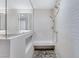 Spa-like bathroom with walk-in shower, built-in seat, and pebble floor at 30 Strada Di Villaggio # 151, Henderson, NV 89011