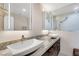 Double vanity bathroom with granite countertop and modern vessel sinks at 30 Strada Di Villaggio # 151, Henderson, NV 89011